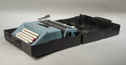 Blue typewriter in a black box