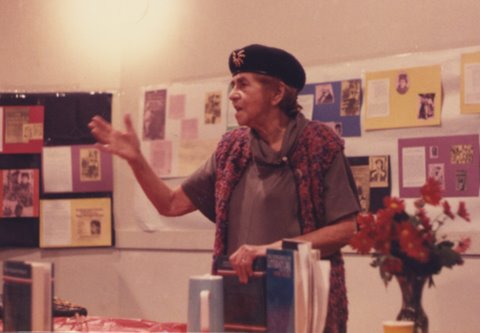 Dunayevskaya lecturing with expressive right arm