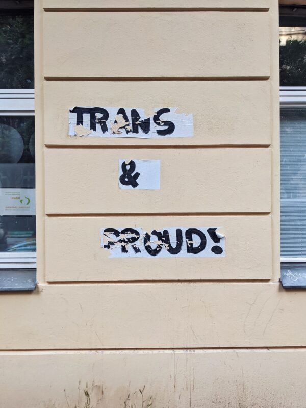 Graffiti which reads Trans & proud