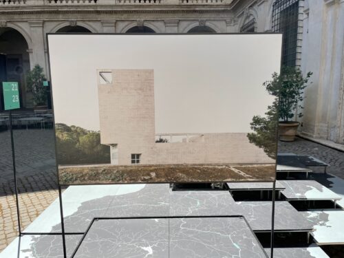 Photo of a photo of a white brick modernist building