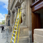 Yellow ladder, old statue