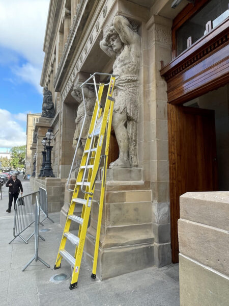 Yellow ladder, old statue